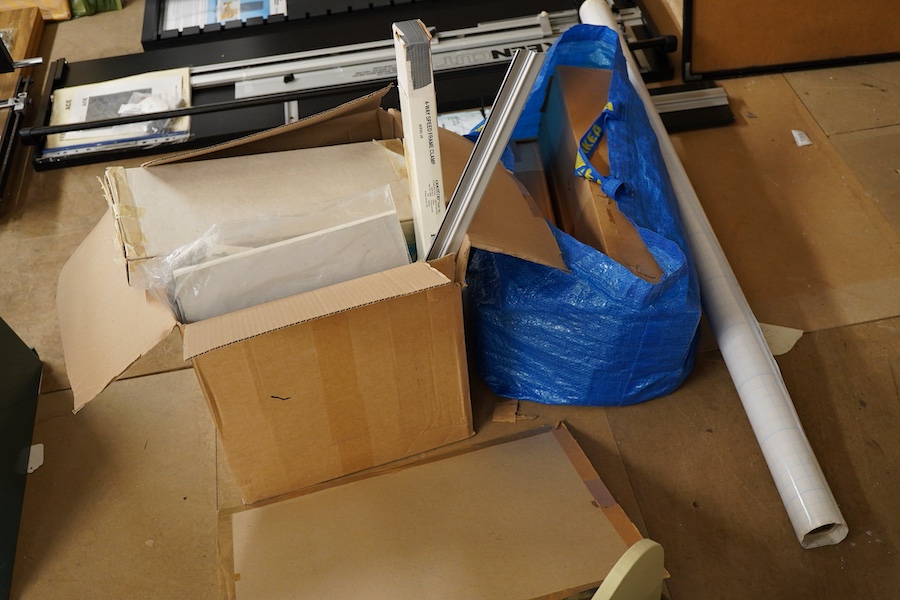 A collection of framing equipment to include Ademco heat press, C & H Bainbridge oval master mount cutter, Longridge baseboard, various mount and backing boards, tools, cutters, clamps and point drivers, many with instru